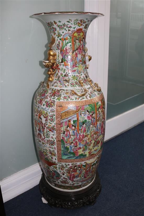 A large Canton floor vase, broken & rivet repaired with carved and pierced hardwood stand